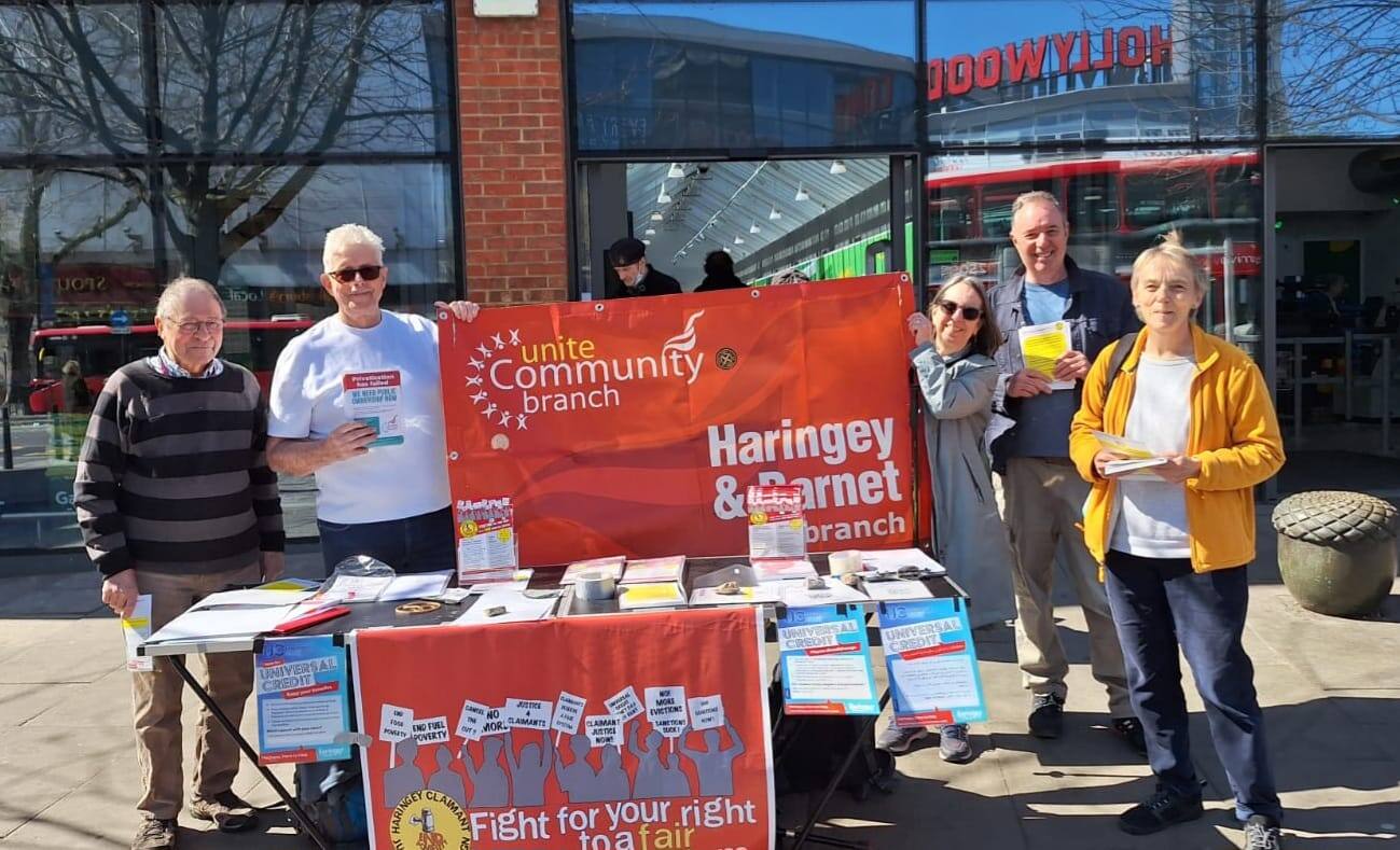 A Unite Community street stall in Haringey, campaigners handing out leaflets and talking to passers-by.